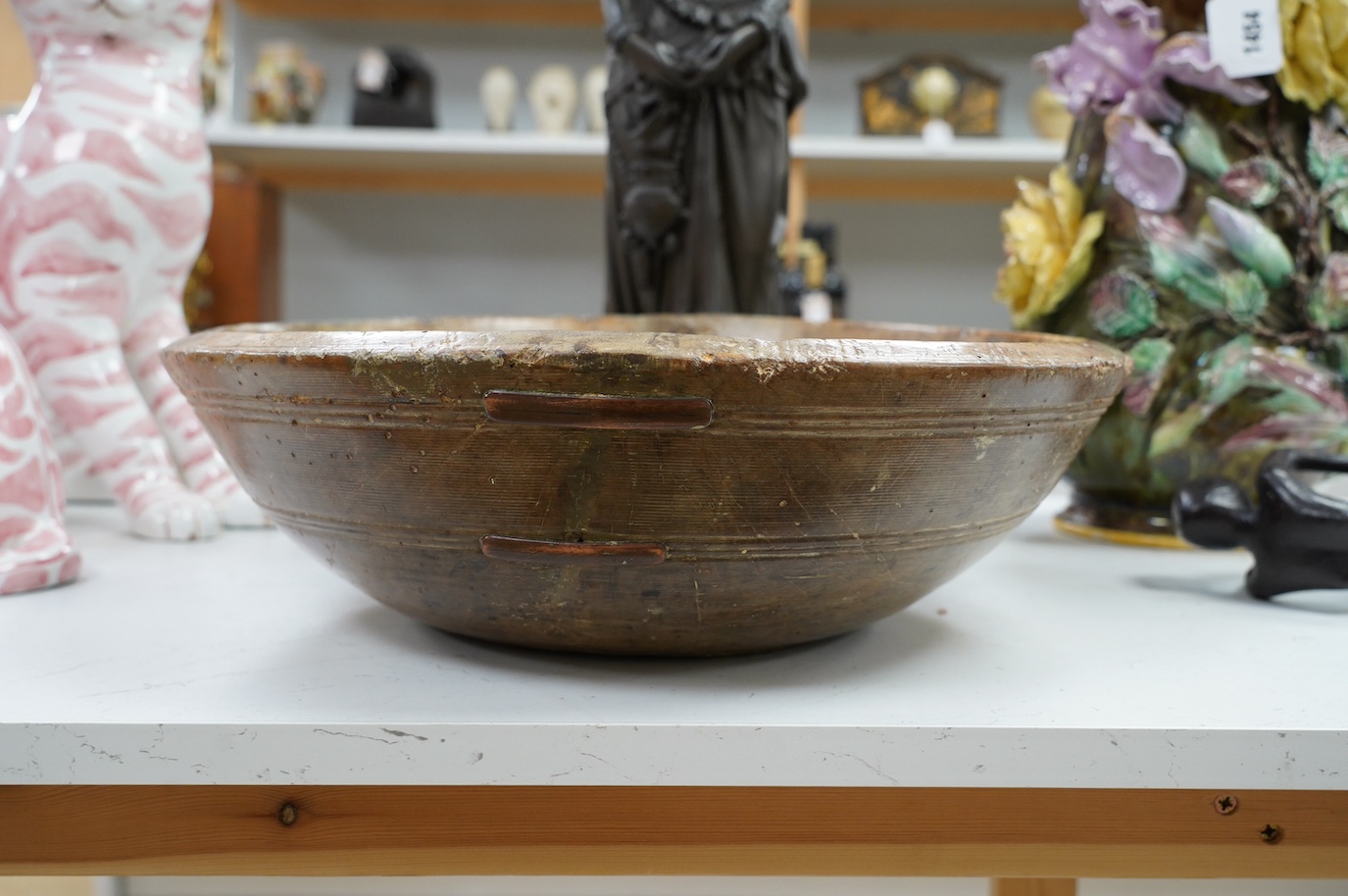 An 18th/19th century sycamore mixing bowl and a smaller bowl, largest 44cm diameter. Condition - poor